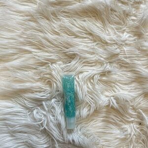Teal Lipgloss with infused flowers